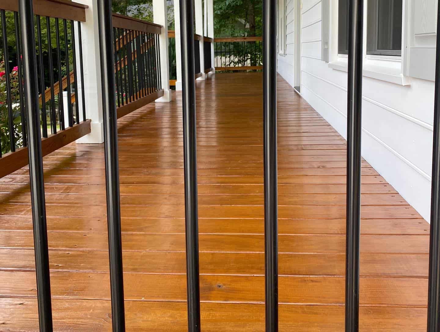 A team of professionals skillfully painting decks and fences in Cary, NC.