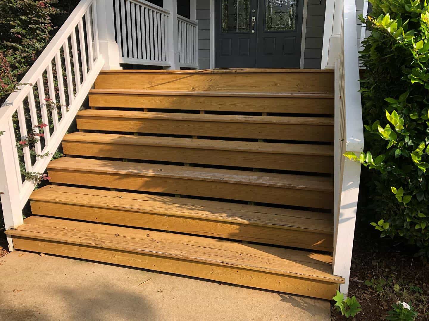 Sprucing up decks and fences in Fuquay Varina, NC with professional painting services.