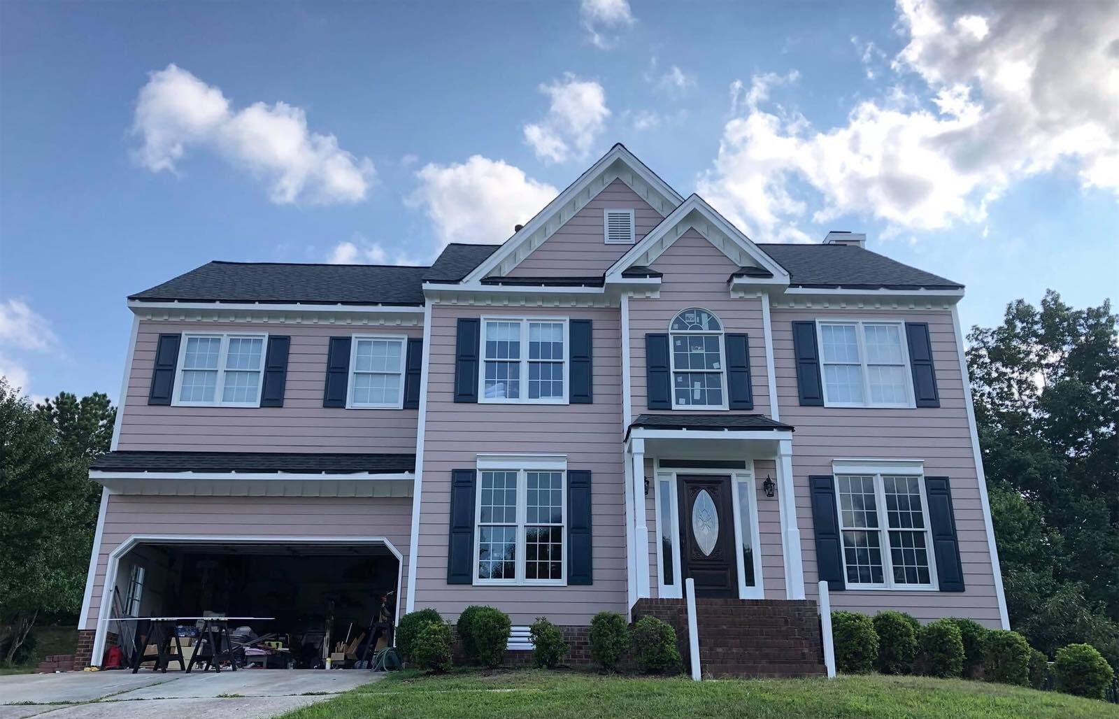 Professional house painters meticulously create captivating interiors in Cary, NC - how long is the drying time for exterior paint