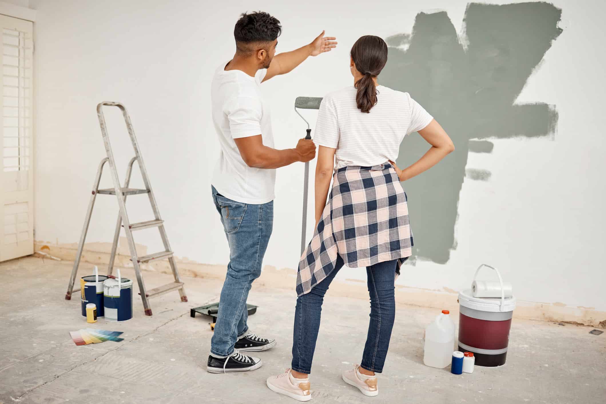 couple fixing painting mistakes